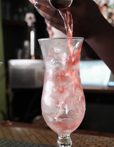 Colorful mixed drinks on a beachfront table