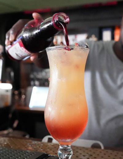 Colorful mixed drinks on a beachfront table