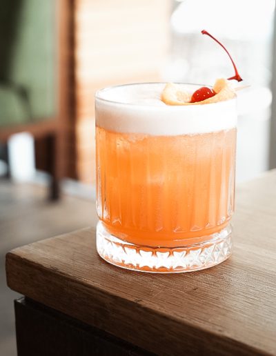 Colorful mixed drinks on a beachfront table